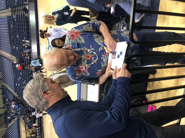 Tim getting and autograph from Hall of Famer Bill Walton in 2019