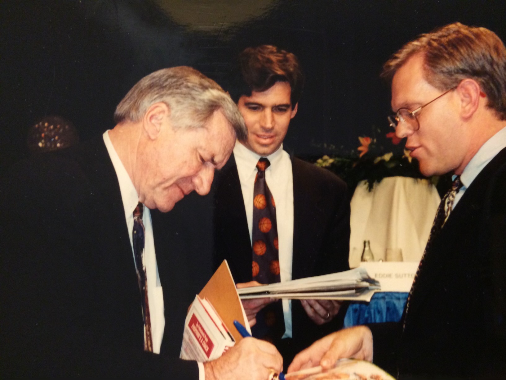 Tim getting an autograph from UNC coaching legend Dean Smith in 1995