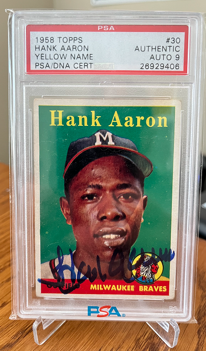 A 1958 Topps Yellow Name Hank Aaron PSA Authentic with a 9 auto