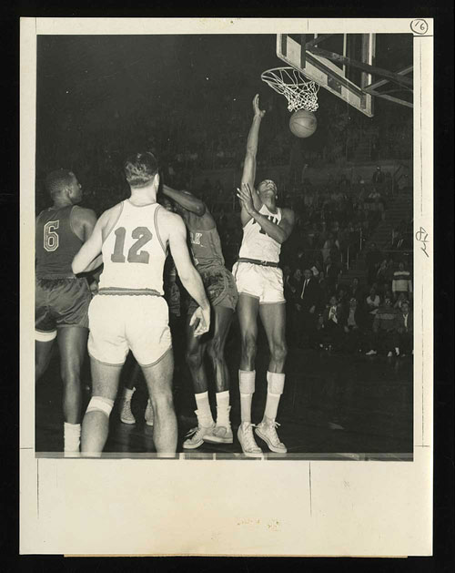 Photo of Wilt Chamberlain scoring his 100th point in 1962 which was consigned by Sheldon with REA in 2016